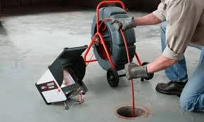 Asphalt core sample extraction with drilling equipment on paved surface